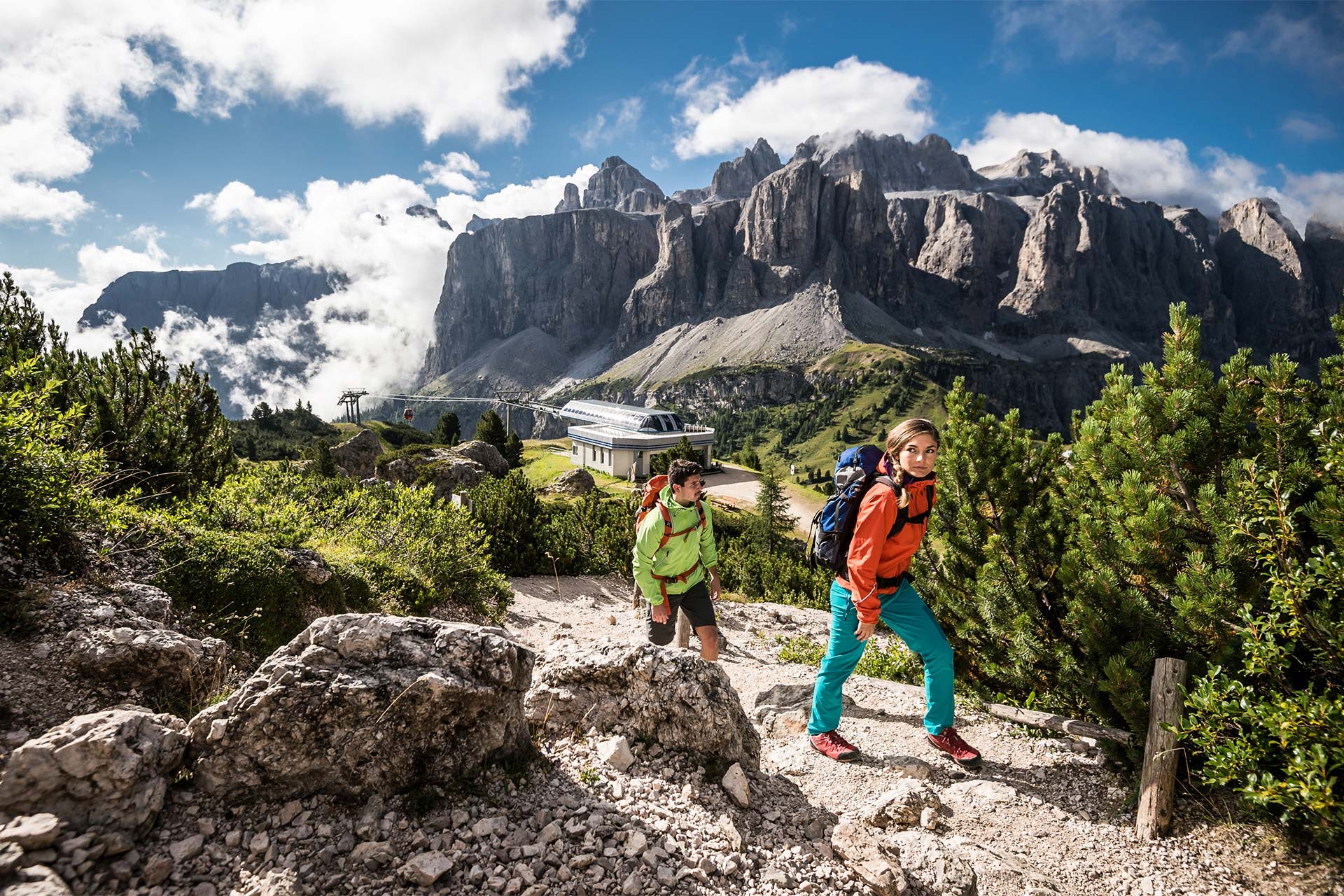 Two young people hiking in the nature of Alta Badia